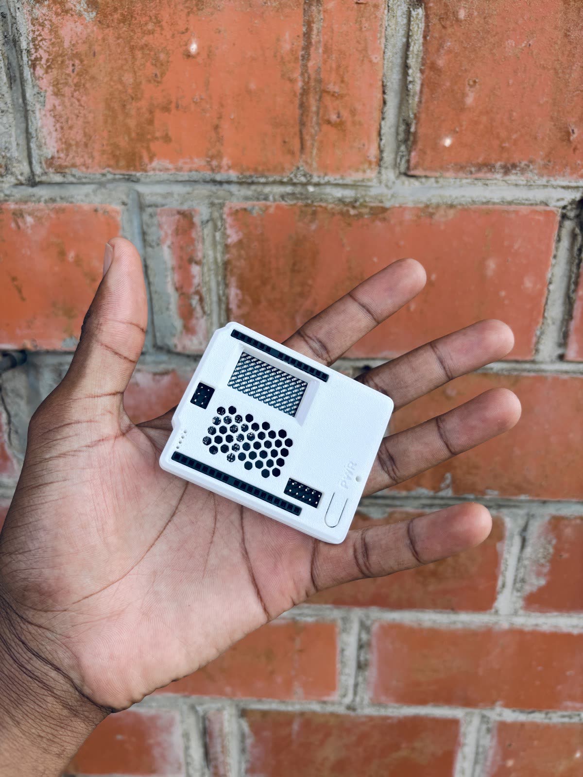 Finished 3D printed Arduino enclosure held in a hand